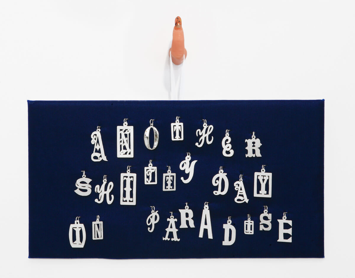 Livia Corona Benjamin
                                        'Another Shitty Day in Paradise', 2015
                                        11 1/2 x 14 x 1 1/2 Inches
                                        silver on velvet, plastic finger, acrylic polish, ribbon
                                        